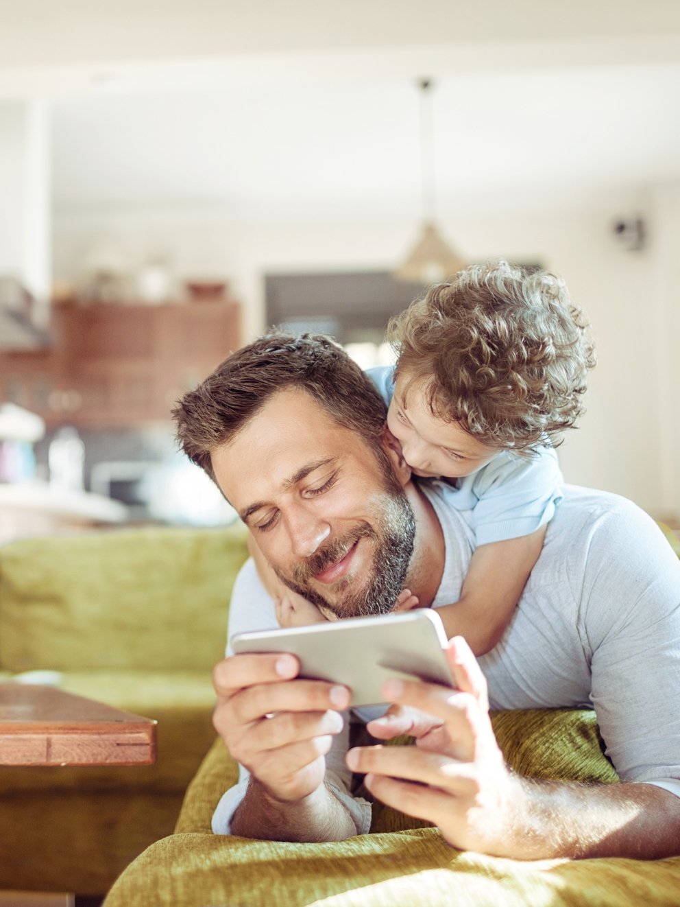 Close up of father and son using a phone
